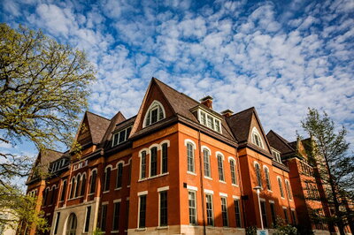 A view of the Natural History Building, with cloud and sky above.